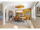 Bright dining room with modern chandelier, neutral color palette, and unique wall art at 2989 Waterford Dr, Conyers, GA 30094