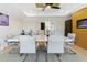 Dining room with modern decor, large table with seating for eight, stylish chandelier, and light-colored walls at 2989 Waterford Dr, Conyers, GA 30094