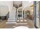 Bright and airy entryway with hardwood floors, high ceilings, staircase, and elegant architectural details at 2989 Waterford Dr, Conyers, GA 30094