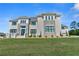 Elegant two-story home featuring a balanced facade with stone accents and manicured front lawn at 2989 Waterford Dr, Conyers, GA 30094
