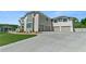 A three-car garage is featured at the end of a long driveway at 2989 Waterford Dr, Conyers, GA 30094