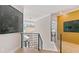 Bright hallway featuring hardwood floors, modern chandelier and eye-catching artwork at 2989 Waterford Dr, Conyers, GA 30094