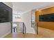 Bright hallway featuring hardwood floors, modern chandelier and eye-catching artwork at 2989 Waterford Dr, Conyers, GA 30094