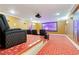 Home theater with tiered seating, large screen, projector, and immersive sound system at 2989 Waterford Dr, Conyers, GA 30094