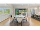 Kitchen and dining area featuring backyard access and kitchen island seating at 2989 Waterford Dr, Conyers, GA 30094