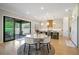 Kitchen and dining area with island seating and an exterior sliding door at 2989 Waterford Dr, Conyers, GA 30094