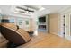 Living room with a tray ceiling and an electric fireplace at 2989 Waterford Dr, Conyers, GA 30094