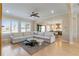 Spacious living room showcasing a large sofa and windows with backyard views at 2989 Waterford Dr, Conyers, GA 30094
