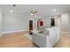 Bright living room features hardwood floors, a comfortable sofa, and easy access to other areas at 2989 Waterford Dr, Conyers, GA 30094