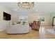Spacious living room with hardwood floors, leather chairs, and large neutral colored couch at 2989 Waterford Dr, Conyers, GA 30094