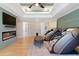 Bright living room features fireplace, TV, ceiling fan, and multiple massage chairs at 2989 Waterford Dr, Conyers, GA 30094