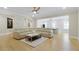 Bright living room with a large sectional sofa, hardwood floors, and an open layout for modern living and entertaining at 2989 Waterford Dr, Conyers, GA 30094