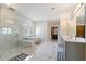 Elegant primary bath features marble floors and shower, soaking tub, and double vanity at 2989 Waterford Dr, Conyers, GA 30094
