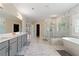 Elegant bathroom with marble floors and walk-in shower with a large soaking tub at 2989 Waterford Dr, Conyers, GA 30094