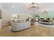 Spacious main bedroom features hardwoods, designer lighting and sitting area at 2989 Waterford Dr, Conyers, GA 30094