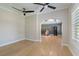 Bright office area with hardwood floors, ceiling fans, and an arched entrance at 2989 Waterford Dr, Conyers, GA 30094