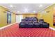Luxurious theater room with comfortable reclining seats, projector, and star-studded carpet for ultimate movie nights at 2989 Waterford Dr, Conyers, GA 30094