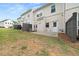 Spacious backyard featuring green grass, a concrete patio, and a wooden privacy fence at 3604 Silvery Way, Powder Springs, GA 30127