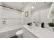 Well-lit bathroom featuring a shower-tub combo and a white vanity with modern fixtures at 3604 Silvery Way, Powder Springs, GA 30127