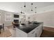 Open concept kitchen with an island, pendant lighting, and a view into the living room at 3604 Silvery Way, Powder Springs, GA 30127