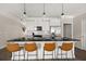 Modern kitchen with an island, pendant lighting, and stainless steel appliances at 3604 Silvery Way, Powder Springs, GA 30127