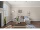 Comfortable living room area featuring cozy seating and stylish decor at 3604 Silvery Way, Powder Springs, GA 30127