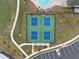 Aerial view of tennis courts, surrounded by lawns and parking spaces at 3604 Silvery Way, Powder Springs, GA 30127