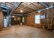 Partially framed basement showcasing exposed wood studs and ductwork, presenting a canvas for personalized renovation at 1855 Vintage Dr, Snellville, GA 30078