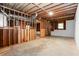 Spacious unfinished basement featuring exposed wood framing and ductwork, offering potential for custom build-out at 1855 Vintage Dr, Snellville, GA 30078