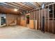 Unfinished basement featuring exposed ductwork and wood framing, offering potential for customization and ample storage at 1855 Vintage Dr, Snellville, GA 30078