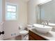 Updated bathroom with bowl sink, wood cabinets and tile floor at 1855 Vintage Dr, Snellville, GA 30078