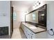 Large bathroom with double sinks, granite counters and walk in shower at 1855 Vintage Dr, Snellville, GA 30078