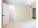 Open bedroom with a connecting closet and a view into other rooms creates a versatile living space at 1855 Vintage Dr, Snellville, GA 30078