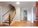 Entryway with hardwood floors and stairs, showcasing the home's interior at 1855 Vintage Dr, Snellville, GA 30078