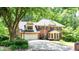 Spacious brick home with a two-car garage, basketball hoop, and well-kept landscaping at 1855 Vintage Dr, Snellville, GA 30078