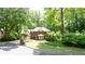 Beautiful two-story brick home with lush landscaping and a curved driveway, creating a welcoming entrance at 1855 Vintage Dr, Snellville, GA 30078