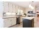 Updated kitchen with granite counters, stainless appliances and center island at 1855 Vintage Dr, Snellville, GA 30078