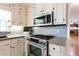 Kitchen with stainless steel stove/oven, subway tile, and granite countertops at 1855 Vintage Dr, Snellville, GA 30078