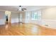 Living room with hardwood floors, fireplace, and large bay window at 1855 Vintage Dr, Snellville, GA 30078