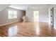 Spacious living room with hardwood floors, bright windows, and open floor plan, perfect for gatherings at 1855 Vintage Dr, Snellville, GA 30078