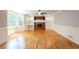 Living room with hardwood floors, fireplace, and large bay window at 1855 Vintage Dr, Snellville, GA 30078