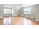 Large living area features hardwood floors, ample windows, and inviting atmosphere, perfect for relaxing or entertaining at 1855 Vintage Dr, Snellville, GA 30078