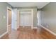 Bedroom featuring hardwood floors, an open closet, and a neutral color wall at 2586 Williamsburg Dr, Decatur, GA 30034