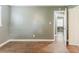 A clean bedroom featuring hard wood flooring and neutral wall paint at 2586 Williamsburg Dr, Decatur, GA 30034