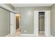 Neutral bedroom with a double-door closet and a door leading to another room at 2586 Williamsburg Dr, Decatur, GA 30034