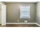 Neutral bedroom featuring a window and an open closet door at 2586 Williamsburg Dr, Decatur, GA 30034