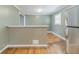 View of kitchen area with refrigerator and window, with hardwood floor at 2586 Williamsburg Dr, Decatur, GA 30034