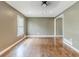 Open living room with hardwood floors, natural light, and neutral wall paint at 2586 Williamsburg Dr, Decatur, GA 30034
