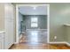 View of open floorplan with staircase and hardwood floors from the kitchen area at 2586 Williamsburg Dr, Decatur, GA 30034