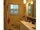 Bathroom with a large mirror, white vanity, and modern fixtures at 2795 Dodson Lee Dr, East Point, GA 30344